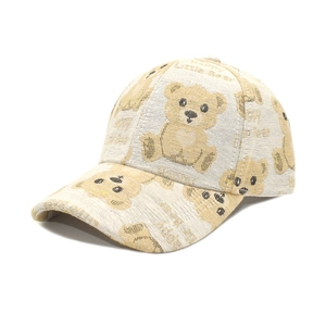 Detail of knitted jacquard texture with cute bear patterns on a baseball cap