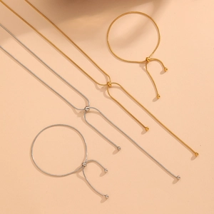 Adjustable snake chain jewelry set in 18k gold and silver steel with sliding ball clasps