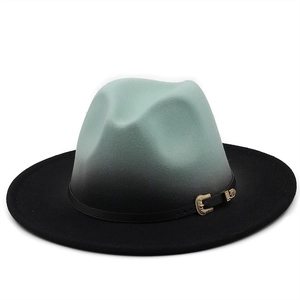 Detailed view of mint green gradient fedora with black ribbon and gold engraved buckle