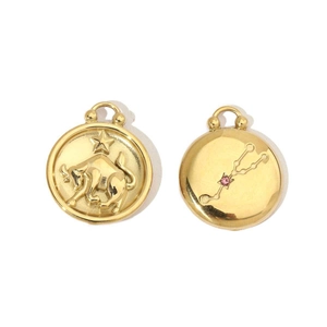 Front and back detail of 14K gold Taurus zodiac pendant with pink gemstone inlay