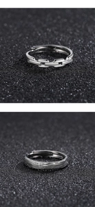 Macro detail of silver adjustable rings featuring chain links and vintage brushed texture
