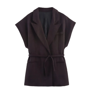 Detail of dark coffee linen vest featuring a notched lapel and adjustable waist tie