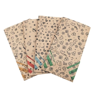 Christmas Kraft paper food bags with festive patterns and colorful striped bottoms