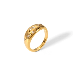Detailed macro view of 18K gold plated ring with star and moon zircon engravings