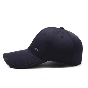 Navy blue cotton baseball cap with silver metal logo and black leather edged brim