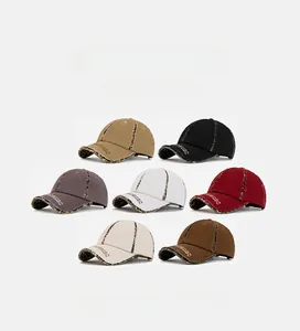Detail of distressed baseball caps featuring leopard print edges and soft cotton fabric