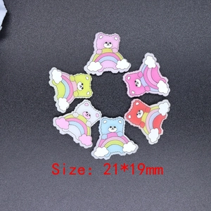 Detailed view of colorful resin rainbow bear charms in six colors for DIY phone cases