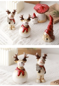 Close-up of vintage ceramic Christmas reindeer and snowman figurine decorations