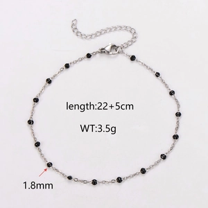 Stainless steel anklet with black beads, length 22+5cm and weight 3.5g on white background