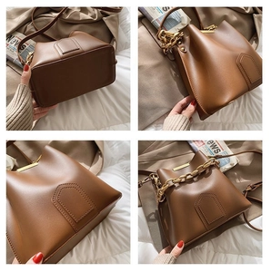 Detailed multi-angle views of brown leather bucket bag with gold chain strap accents