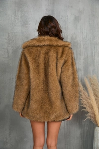 Back view of a long brown faux fur coat showing its plush texture and warm winter design