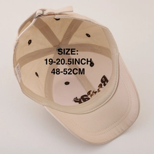 Beige cotton kids baseball cap with bear embroidery, showing interior lining and strap