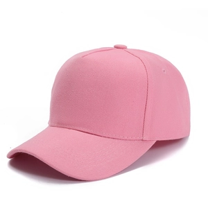 Detail of pink five-panel baseball cap showing twill fabric texture and curved brim