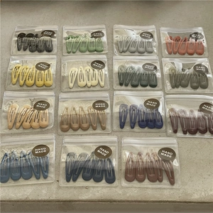Set of colorful matte enamel drop hair clips in multi-color handmade packaging