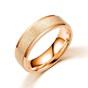 Detail of rose gold titanium steel ring with frosted finish and polished inner band