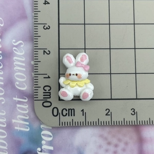 Mini resin cartoon rabbit charm on scale mat measuring 1.5cm for DIY crafts