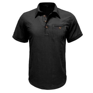 Detail of black cotton linen shirt featuring buttoned neckline and front pocket texture