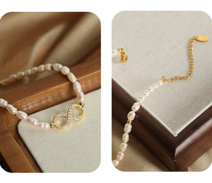 Detailed view of freshwater pearl bracelet with infinity charm and gold lobster clasp