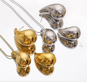Polished 18K gold and silver teardrop jewelry set with necklace and stud earrings