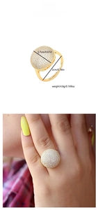 Detail view of gold dome ring with full micro-pave white zircon stones and size measurements