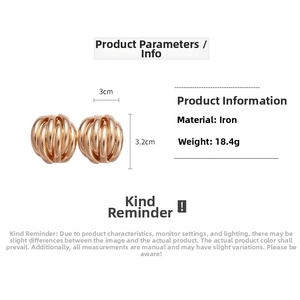 Detail view of multi-layered textured gold geometric earrings with size and weight info