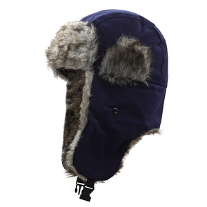 Detail of navy trapper hat with windproof shell and thick faux fur earflap lining