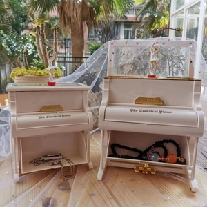 Mechanical piano music box with rotating ballerina and jewelry storage compartment