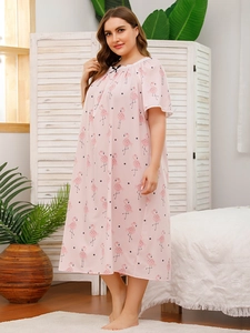 Pink plus size nightdress with flamingo prints, lace neckline and black bow detail