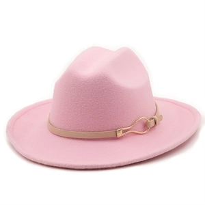 Pink felt fedora hat with wide flat brim and leather band featuring golden buckle