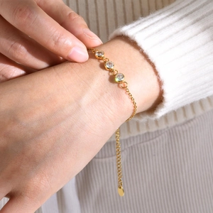 Elegant gold stainless steel chain bracelet for women featuring three clear zircon stones