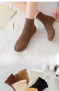 Detail of cotton crew socks with diamond knit patterns and elegant ruffled lace cuffs