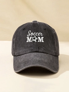 Close-up of Soccer MOM embroidery with soccer ball icon on dark gray washed baseball cap