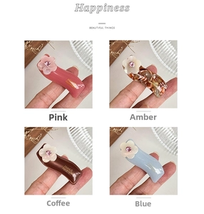 Detailed hair clips with acetate flower designs and sparkling rhinestones in four colors