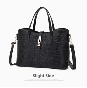Close-up of black crocodile pattern leather tote bag with elegant gold twist lock detail