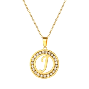 Detail shot of golden letter J pendant featuring a sparkling crystal-encrusted halo design