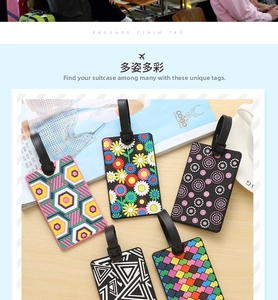 Group of colorful PVC luggage tags with various geometric patterns on wooden desk