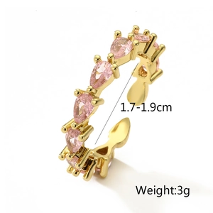 Detailed close-up of gold plated ring with pink zircon stones and adjustable size markers