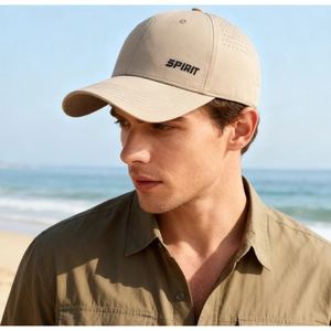 Detail of beige quick-dry baseball cap with SPIRIT lettering and breathable eyelets