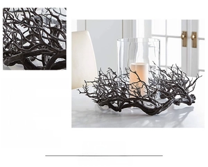 Detailed view of realistic black coral-shaped branch wreath used as a gothic table centerpiece