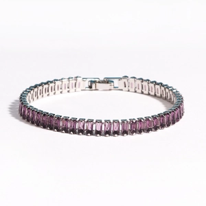 Detail of tennis bracelet with rectangular purple zircons and silver folding clasp