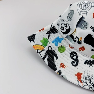 Close-up of Halloween bucket hat featuring pumpkin and ghost prints with reinforced stitching