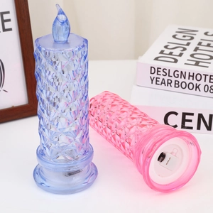 Detail view of the battery compartment and switch on pink crystal rose LED candle lamp