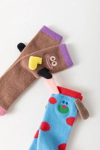 Detail of coral fleece thick warm socks with cute cartoon monster and dog designs