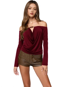 Burgundy off-shoulder long sleeve top with beaded cowl neck and brown leather shorts