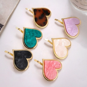 Set of six heart-shaped acetate ponytail hair hooks with elegant tortoiseshell textures