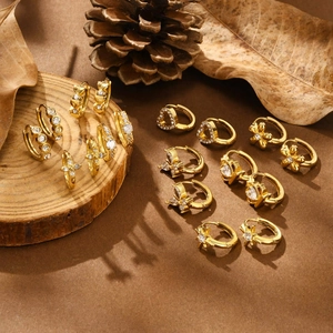Golden stainless steel huggie earrings set with heart, star and butterfly charms