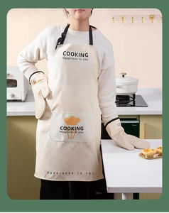 Close-up of beige silicone kitchen oven mitt and apron set with non-slip texture