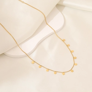 Elegant gold flower pendant necklace for women on white silk display for daily fashion