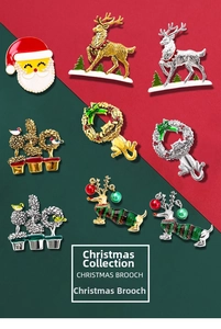 Detail of Christmas brooches featuring Santa, elk, and puppy icons with enamel and pearls
