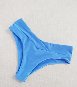 Close-up of royal blue high-waisted bikini bottoms with elastic knit texture